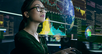 Woman examines economic data in futuristic office